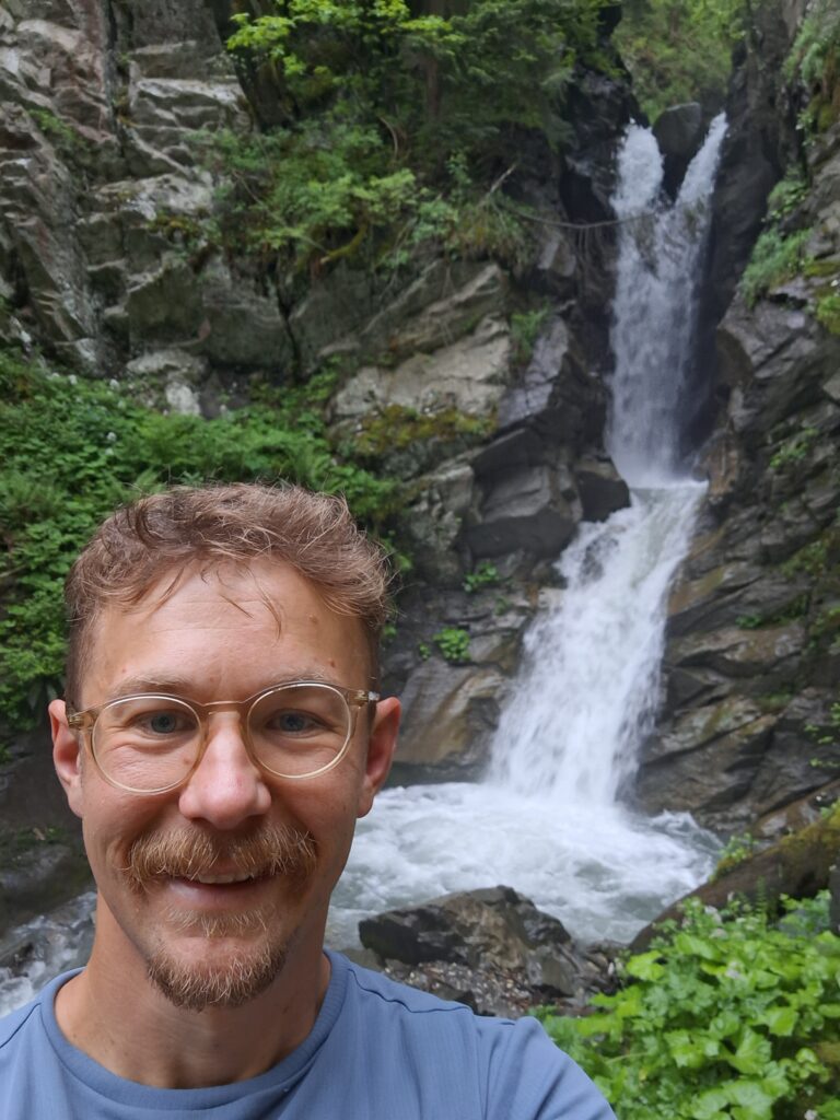 Olle Andersson by a waterfall